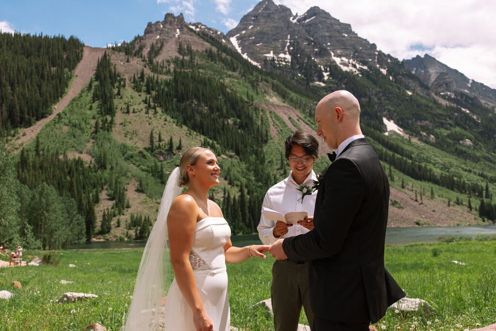bride looks emotionally at groom during ceremony maroon bells elopement aspen colorado