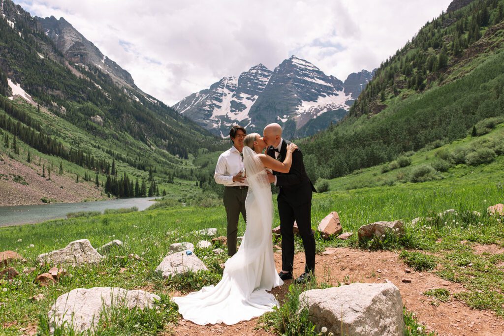 Bride and groom share emotional first kiss at Maroon Bells in Aspen, Colorado